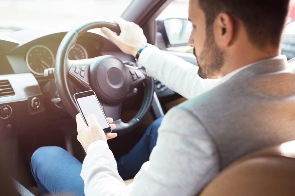 mobile phone driving law Dubai